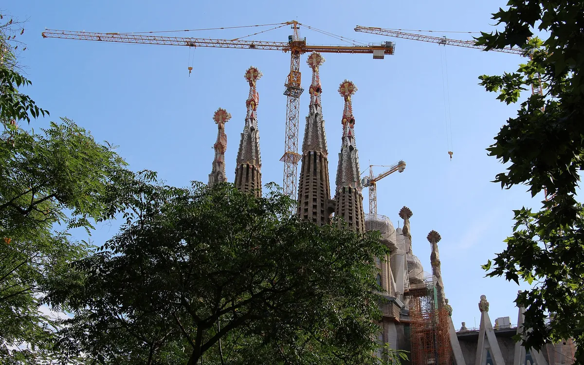 The spires of the Sagrada Familia in Barcelona, still ringed by tower cranes